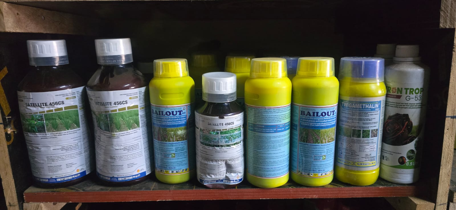Agrochemicals and farm input bottles on display at Tebere Hardware